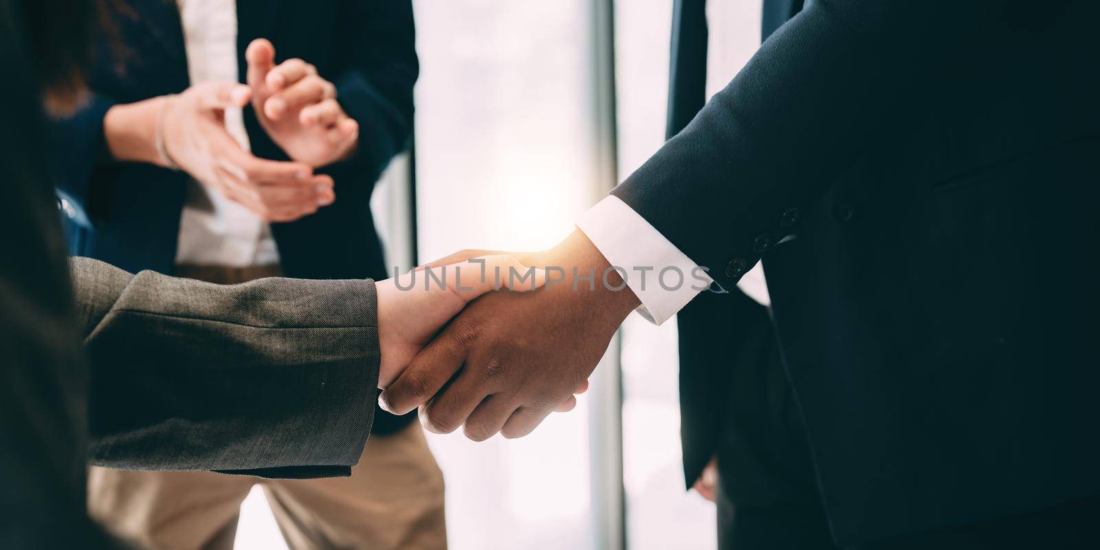 businessman handshake for teamwork of business merger and acquisition.