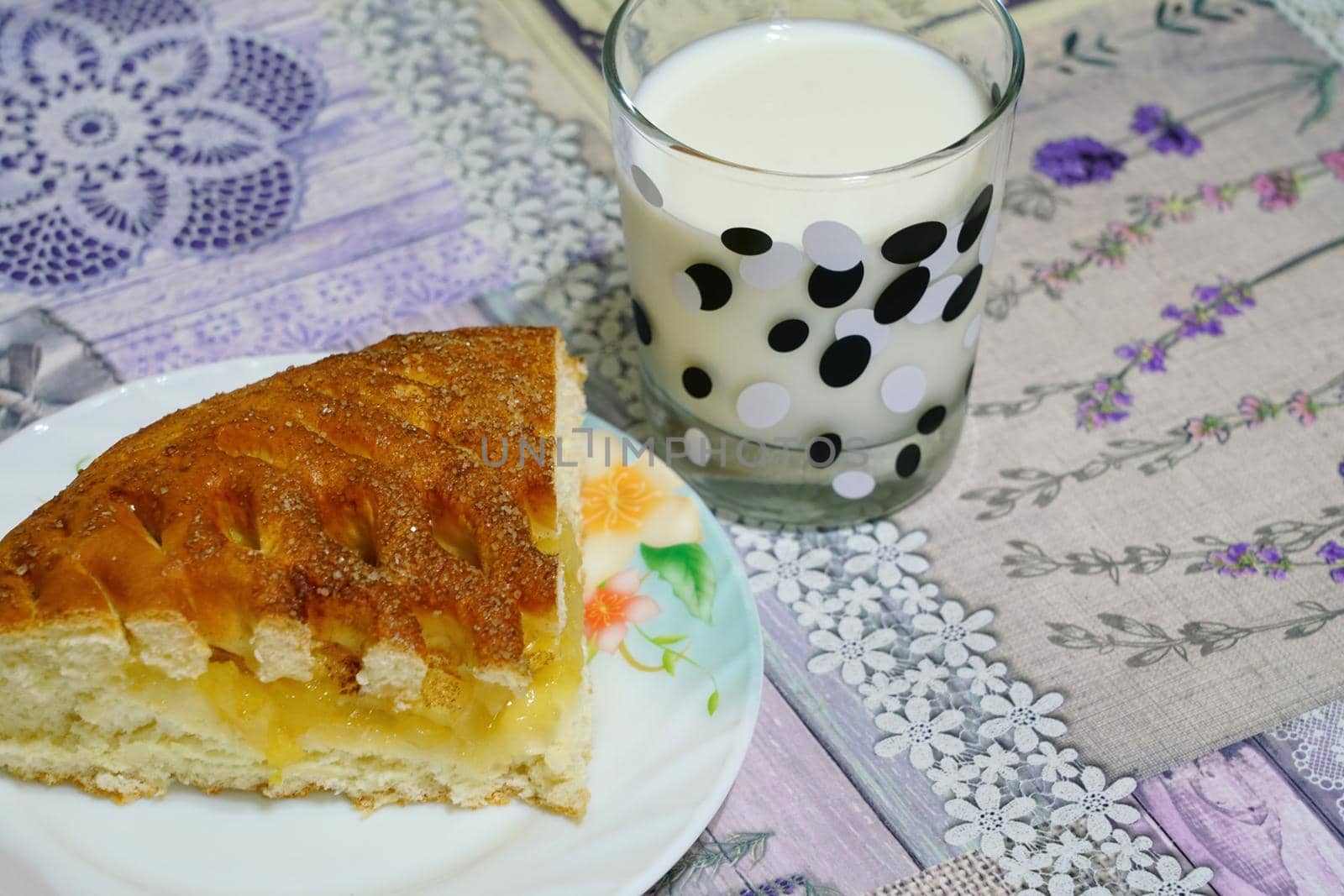 apple pie with a glass of milk on the table by roman112007