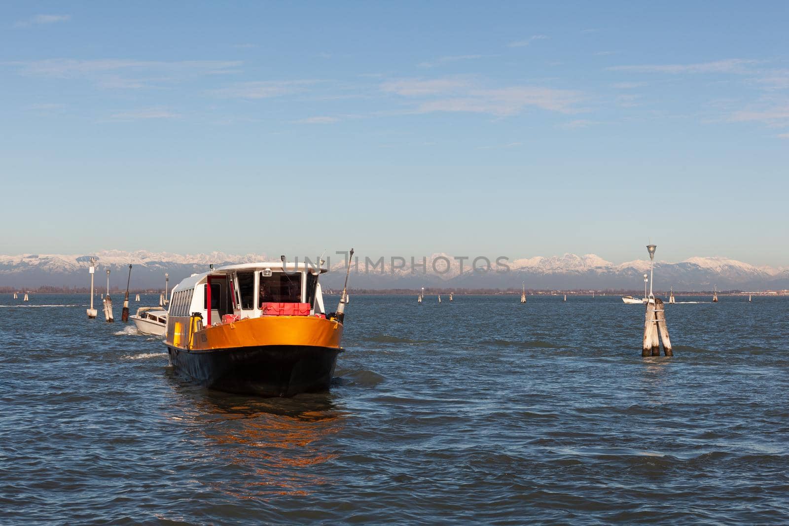 View of the typical vaporetto boat in the Grand Canal in Venice by bepsimage