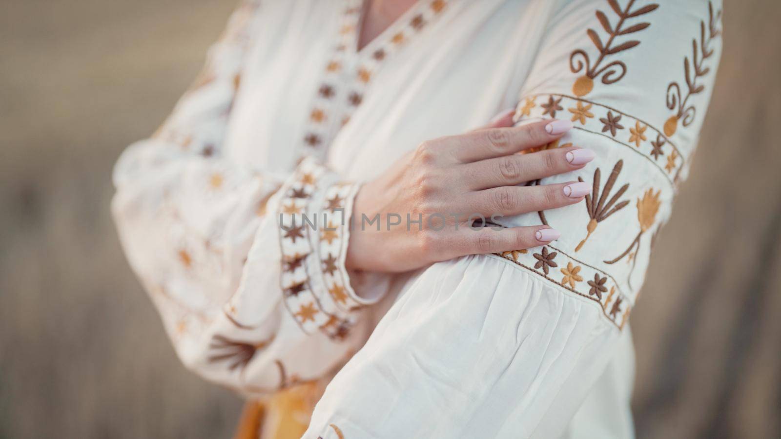 Ukrainian woman showing embroidery ornament, beautiful details of vyshyvanka shirt. National costume - embroidered shirt, texture, design, folk, handmade craft needlework by kristina_kokhanova