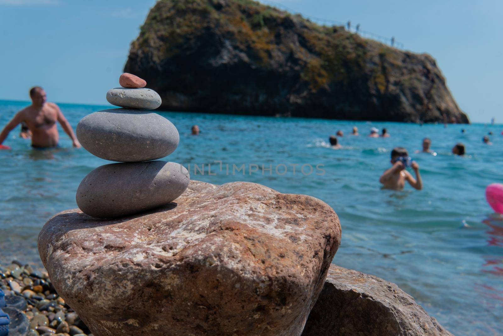 Meditation sea pyramid zen balance beach stones summer stacked rest, from relax stone from calm for blue background, tranquil travel. Gravel abstract outdoors,