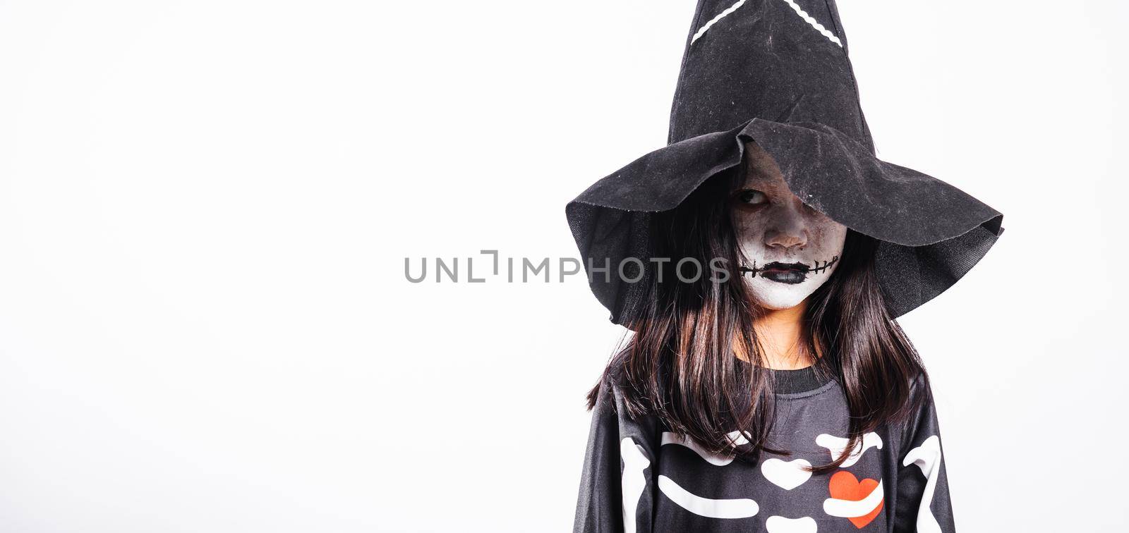 Halloween Kid. Child woman horror face painting make up for ghost scary, Portrait of Asian little kid girl wearing witch costume studio shot isolated white background, Happy halloween day concept