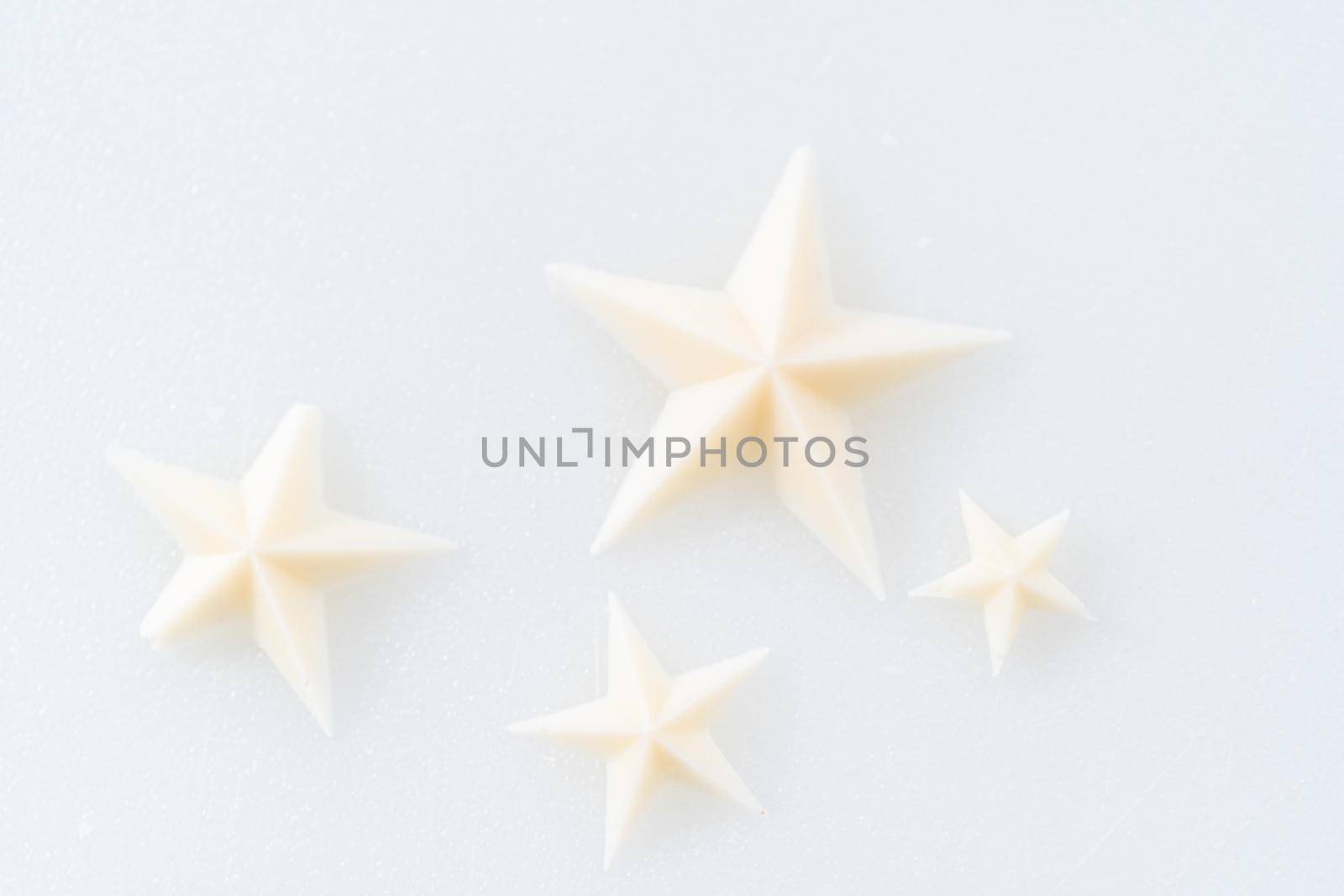 White chocolate stars in a silicone mold.