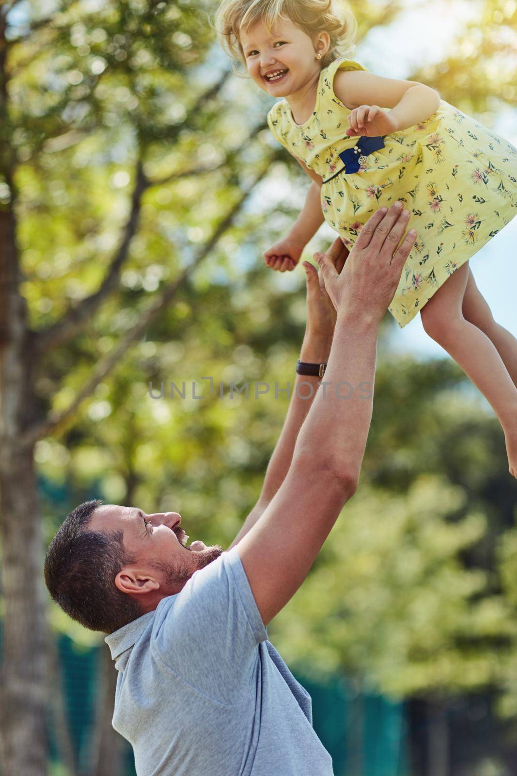 Out for a whole lot of fun. a father bonding with his little daughter outdoors