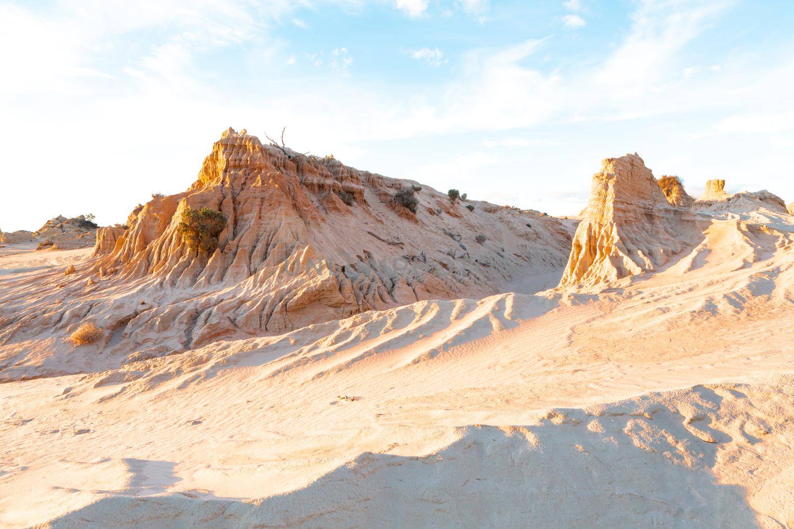 Sculpted by nature desert land forms rise up out of the desert landscape by lovleah