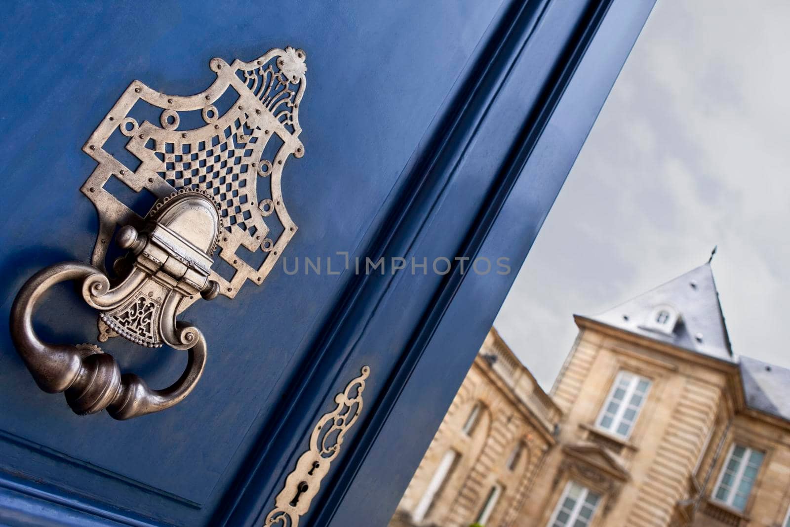 Door and knocker of a French mansion in Bordeaux