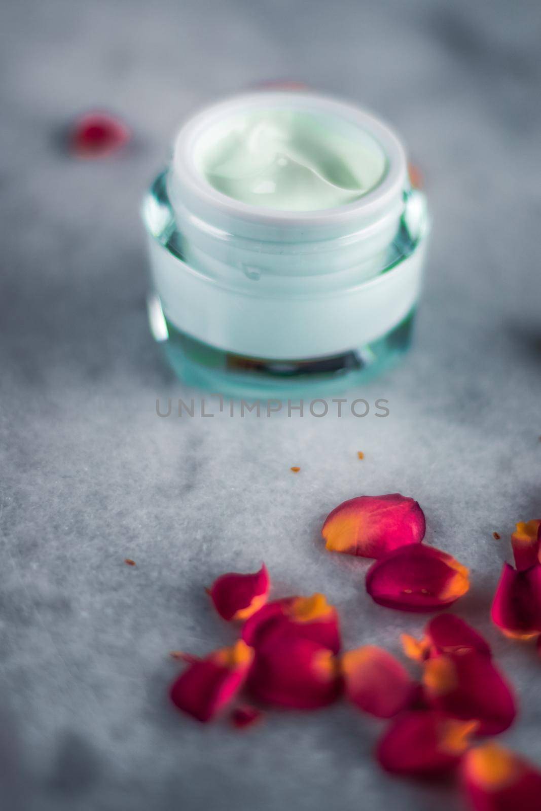 luxe face cream and rose petals - cosmetics with flowers styled beauty concept by Anneleven