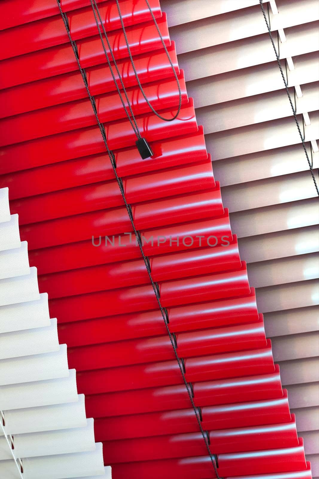 Close up of various Venetian blinds inside a house