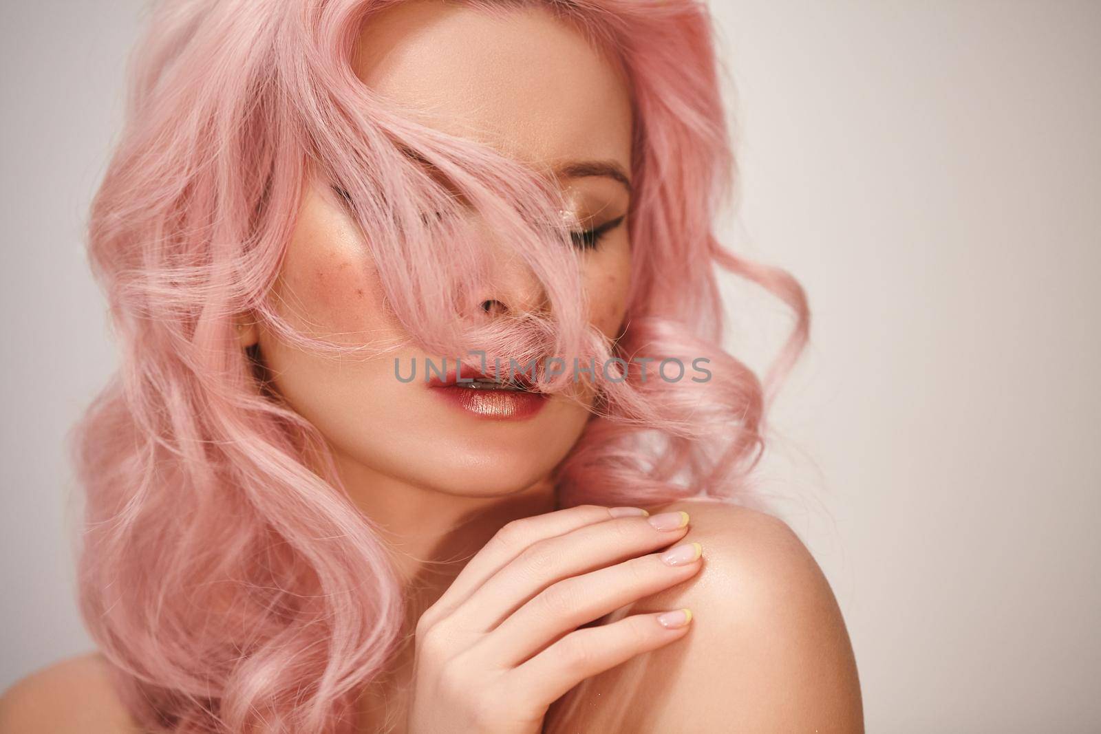 Soft-Girl Style with Trend Pink Flying Hair, Fashion Make-up. Blond Woman Face with Freckles, Blush Rouge, Rose Color by MarinaFrost