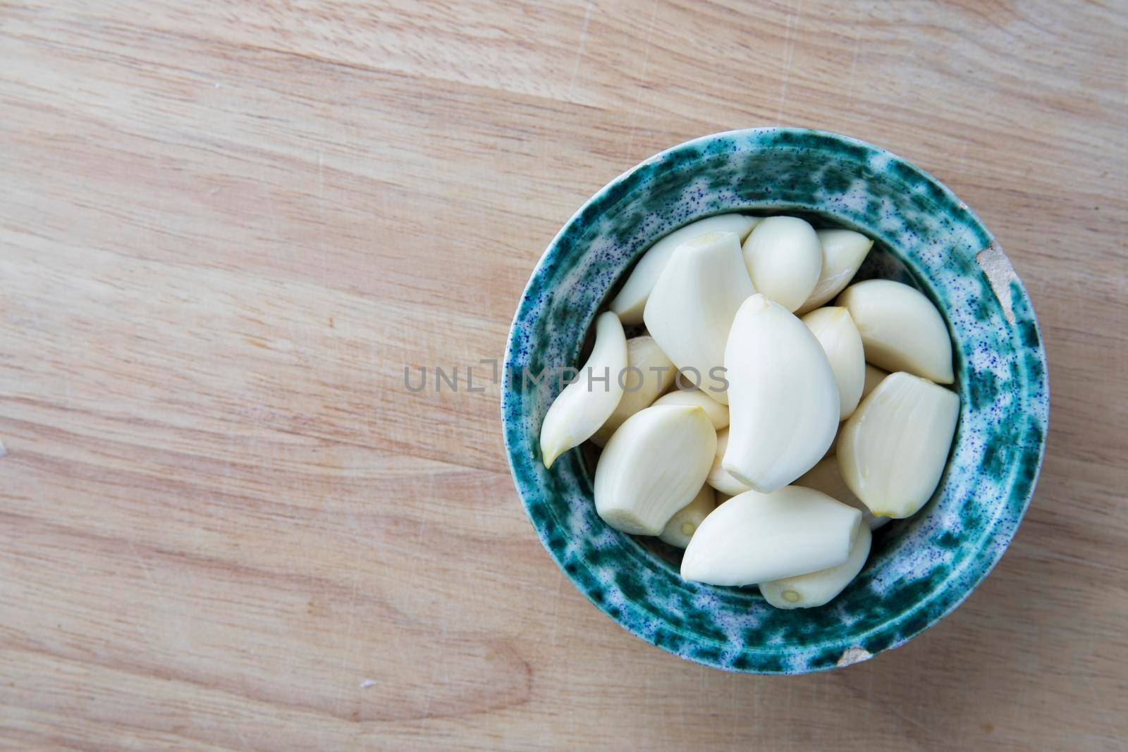 Peeled Garlic Coves in Bowl by charlotteLake