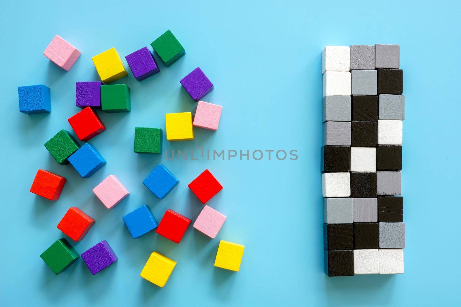 Colored cubes and line of black and white cubes. Diversity and inclusion concept.