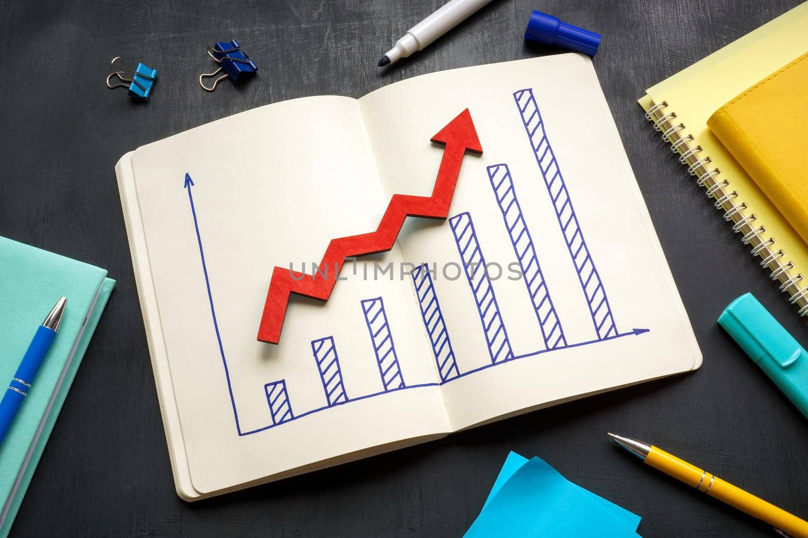 Savings growth concept. A Graph and rising arrow.