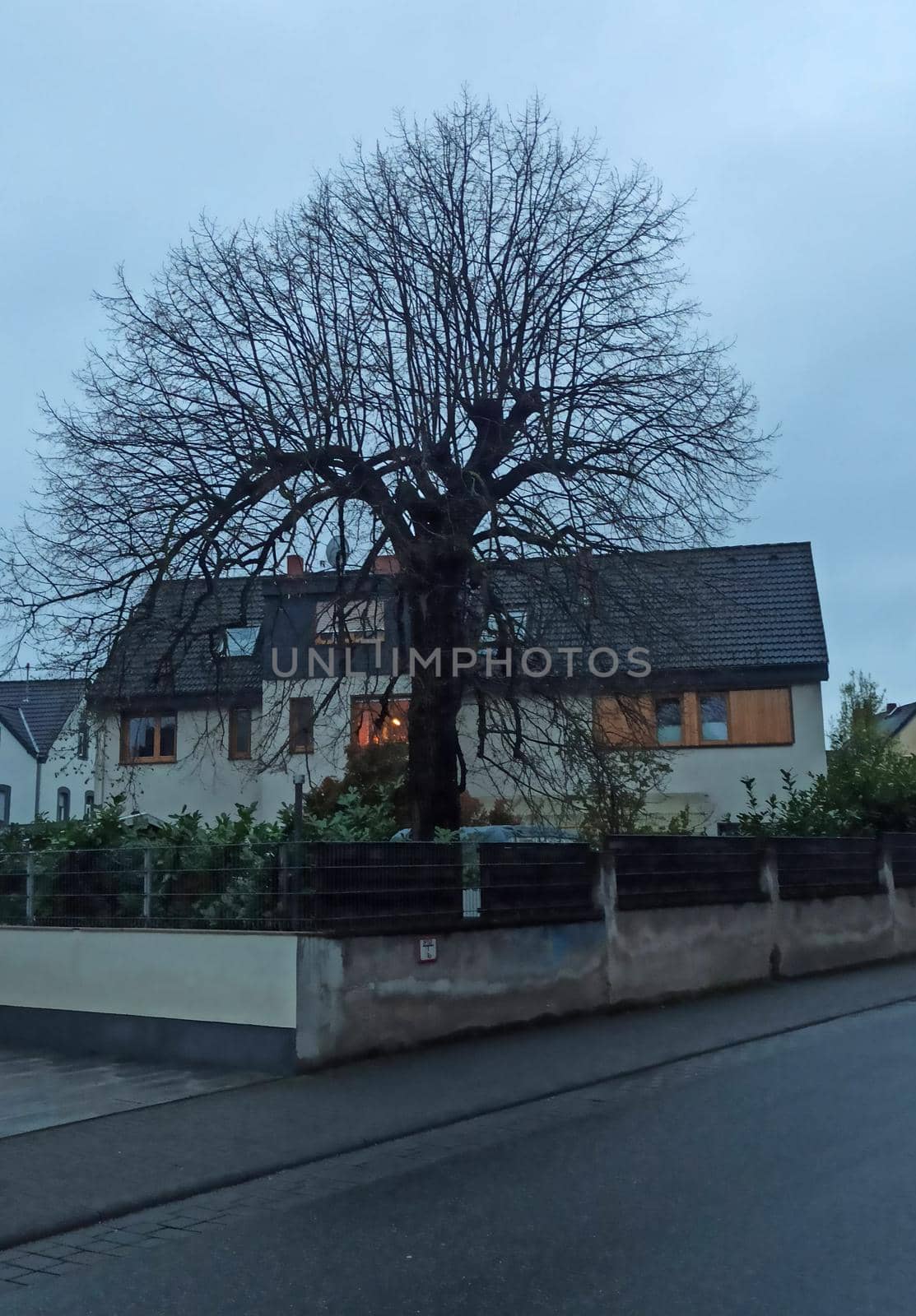 Old residential building in Germany. Cloudy and dusk. Gothic atmosphere by biruzza