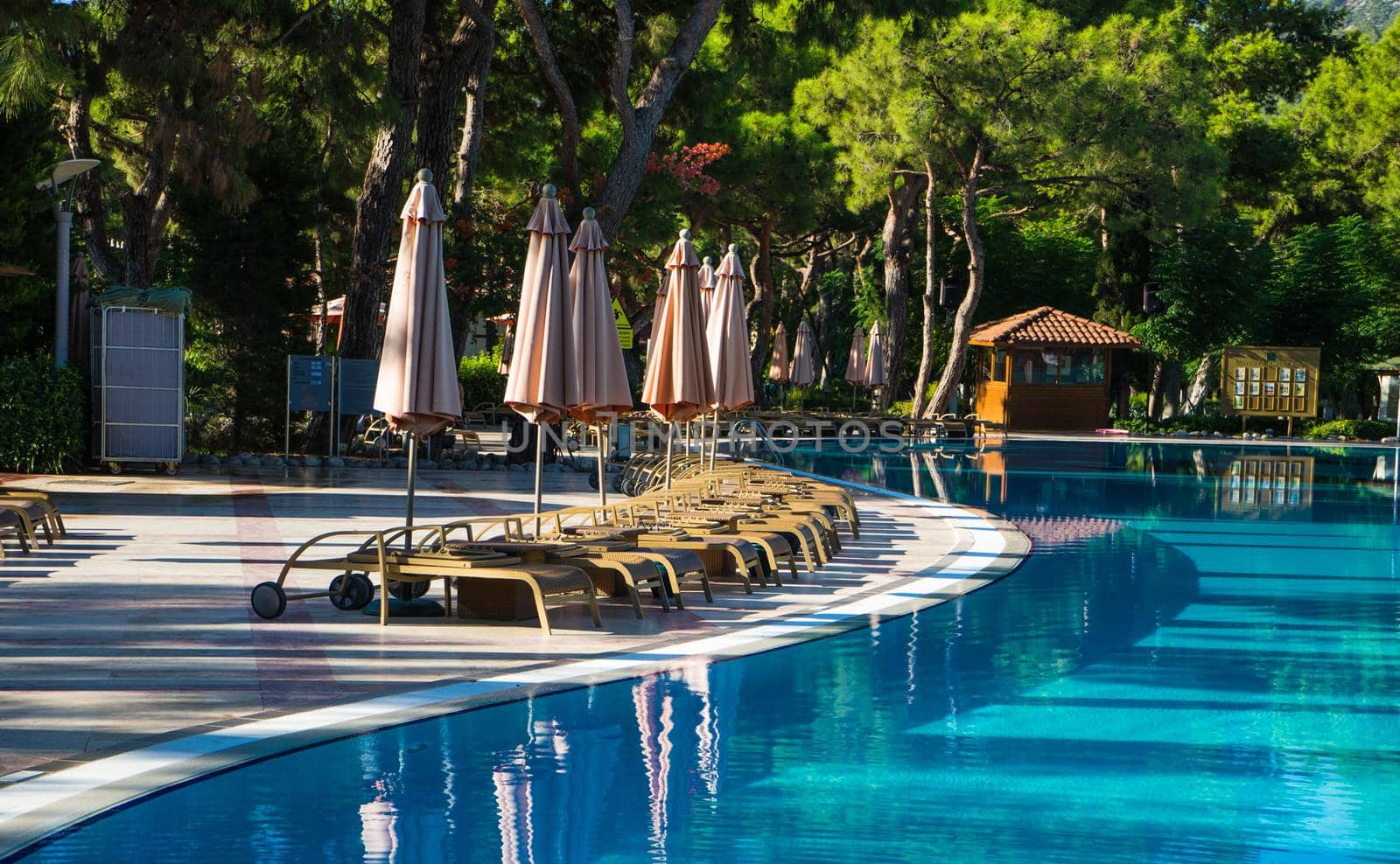 Blue swimming pool rippled water detail as a relax concept