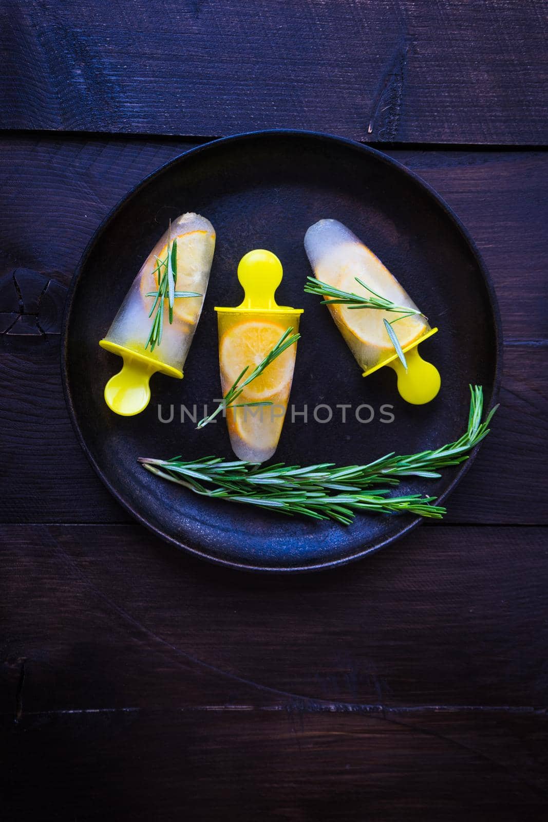 Summer dessert with lemon and mint on rustic wooden background with copyspace