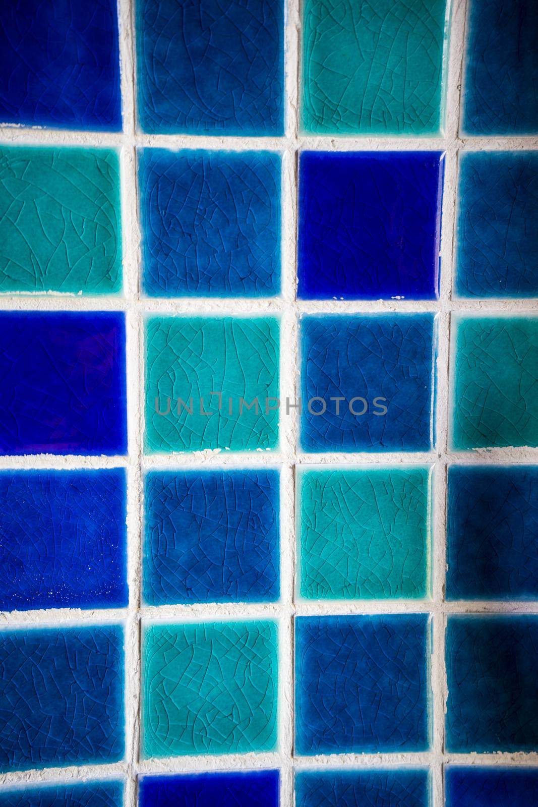 Blue mosaic decoration on a wall in rural house