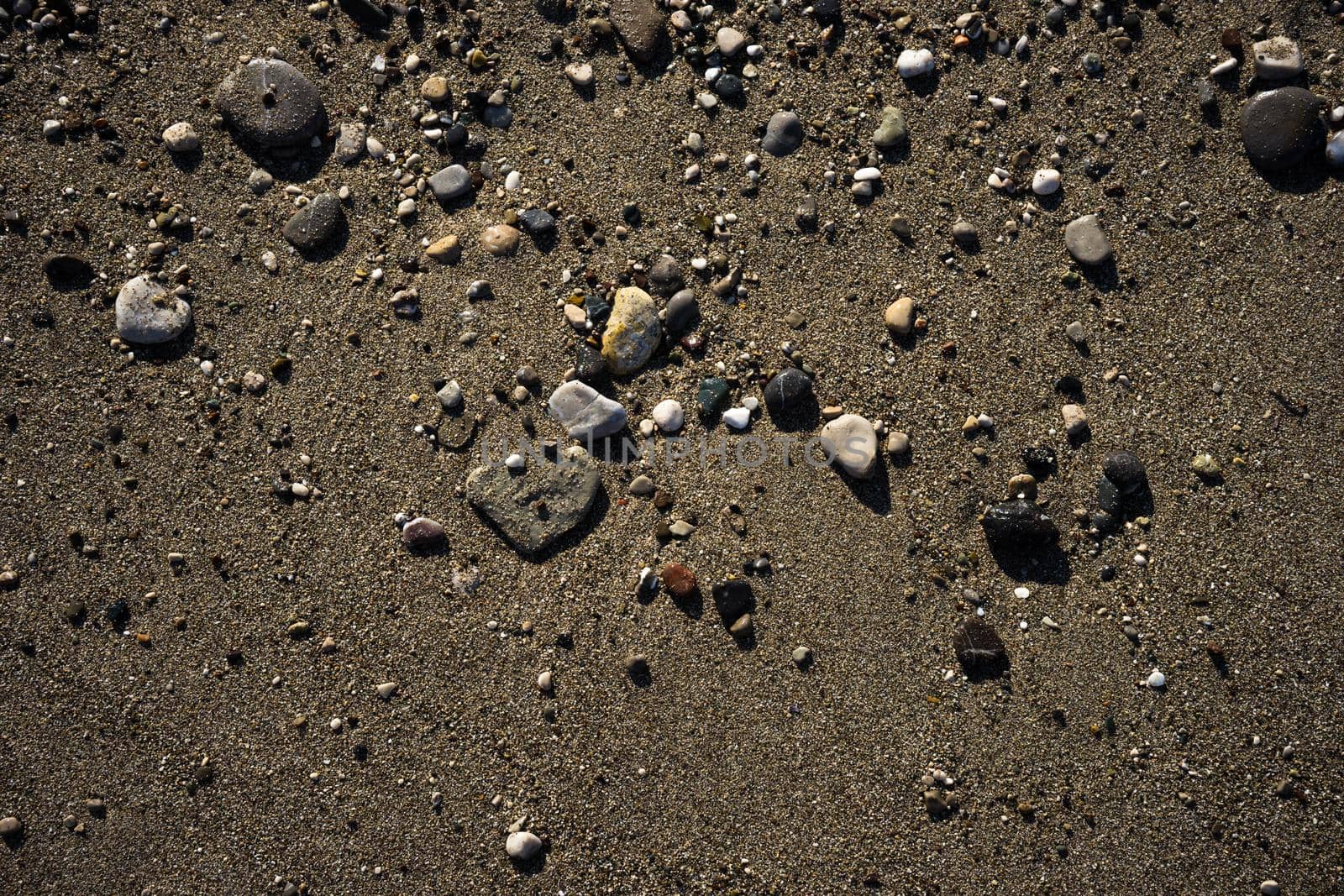 Summertime relax on the sand beach with sea waves