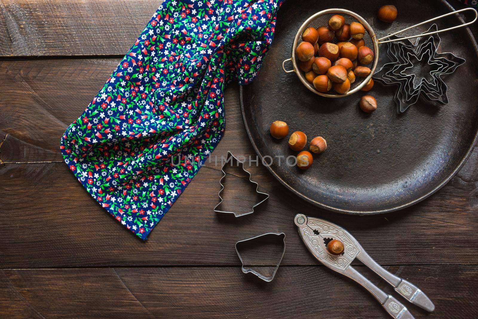 Christmas time cooking concept with flour and cookies forms on dark wooden table
