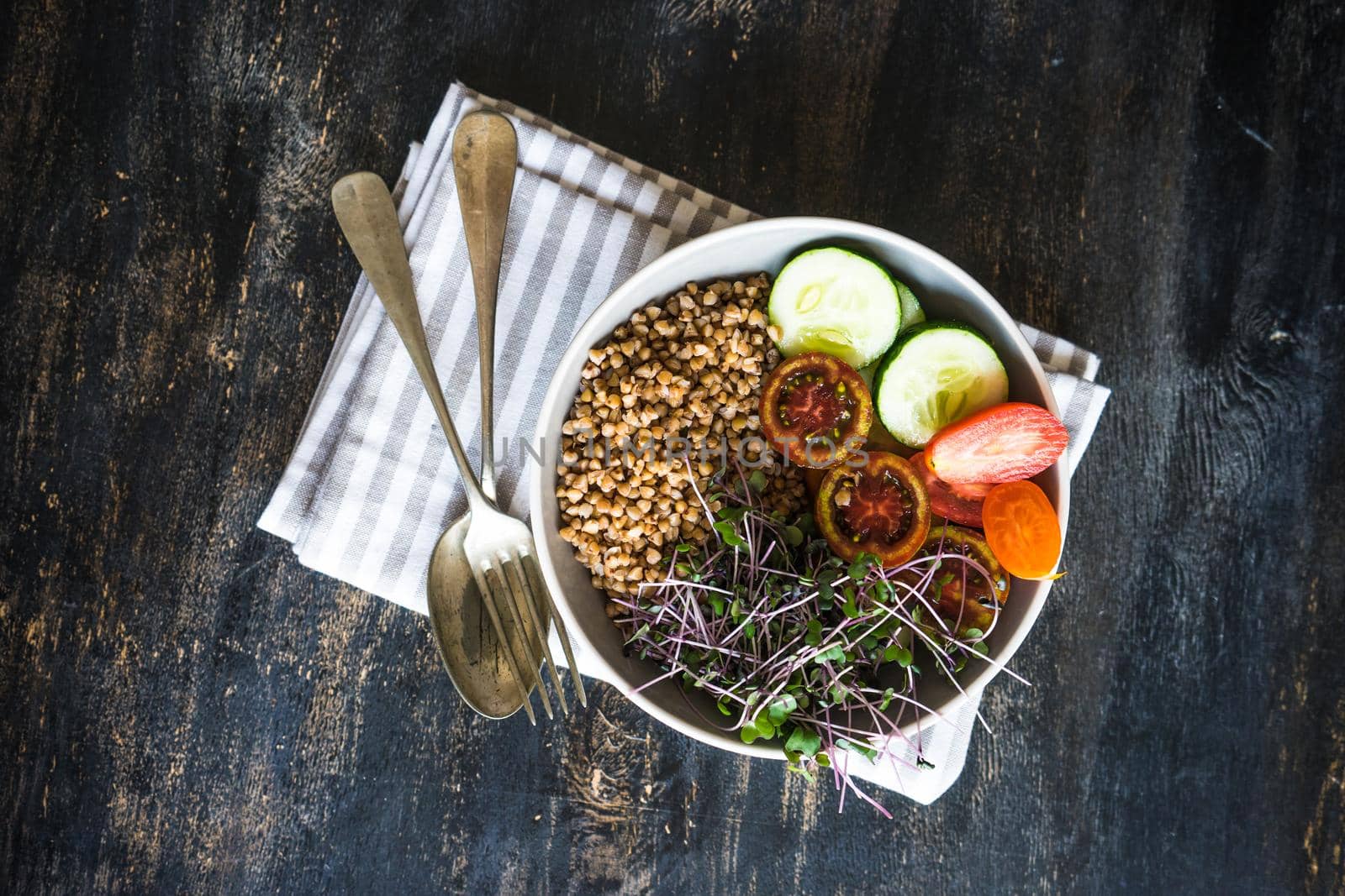 Budha bowl with fresh organic vegetables and red cabbage sprouts as a healthy food concept