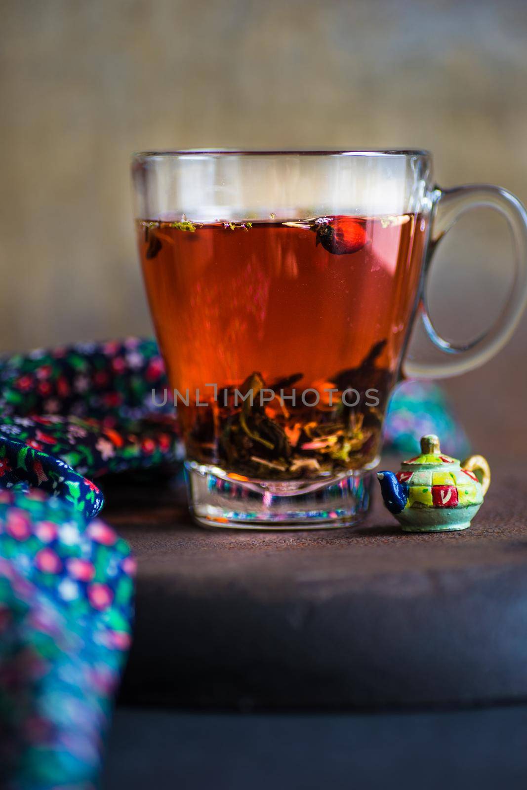 Different types of tea, green tea, peony and ginger tea, rose bud and wild flowers tea on dark wooden background with copyspace