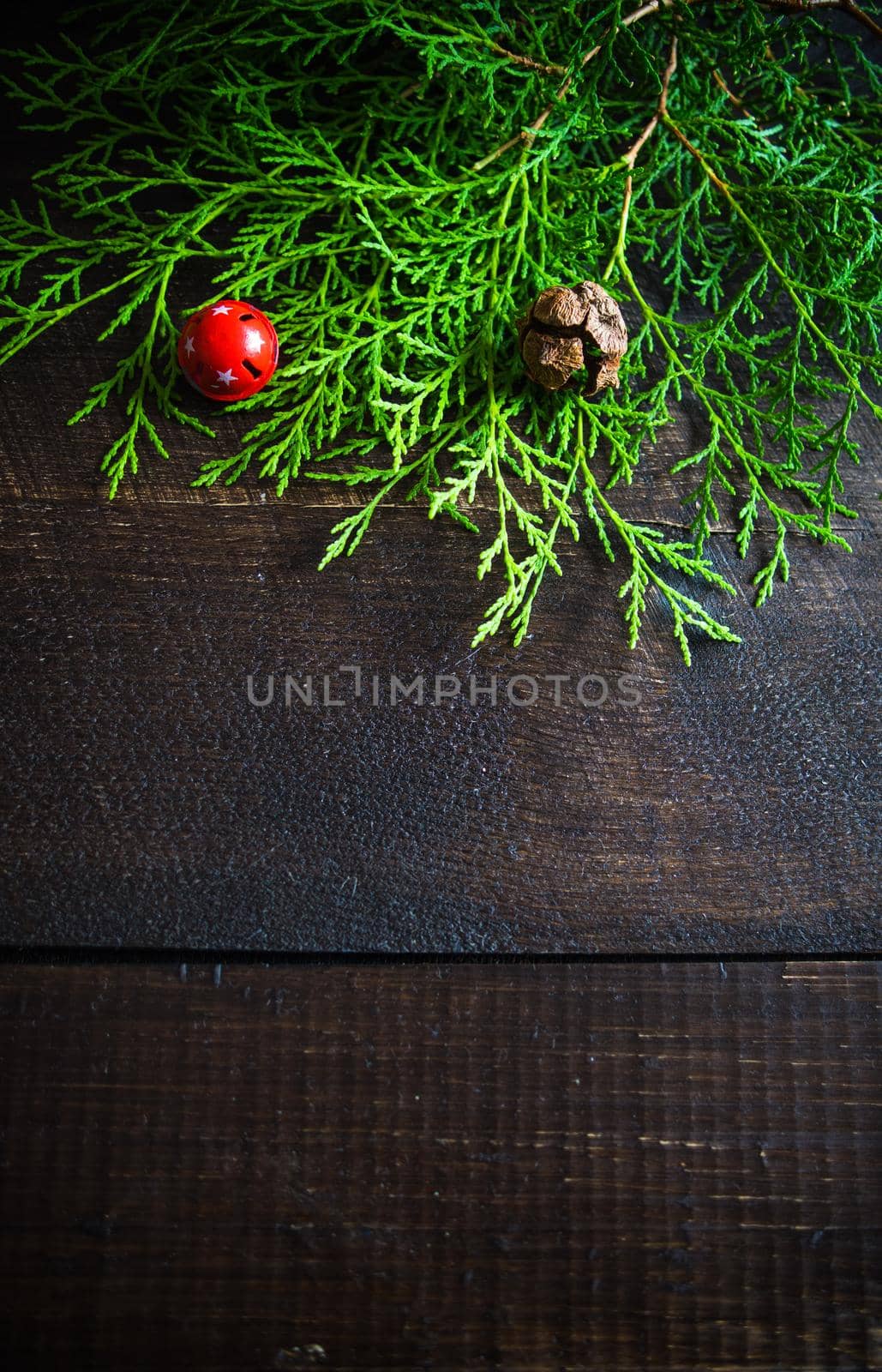 Christmas sweets and gift boxes on rustic background with copyspace