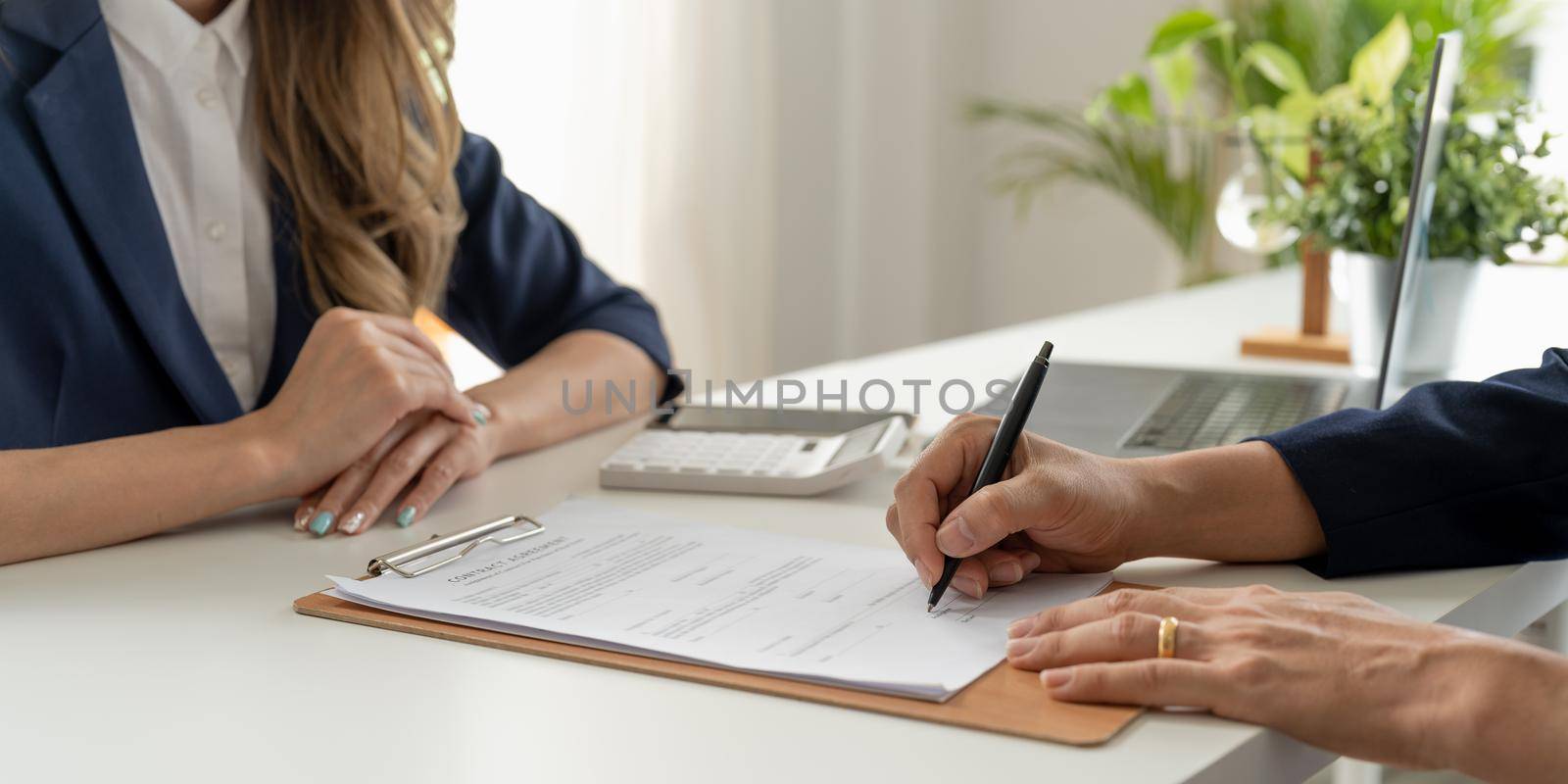 Real estate agent offer contract to customer sign agreement contract signature for buy or sell house. Real estate concept contact agreement concept.