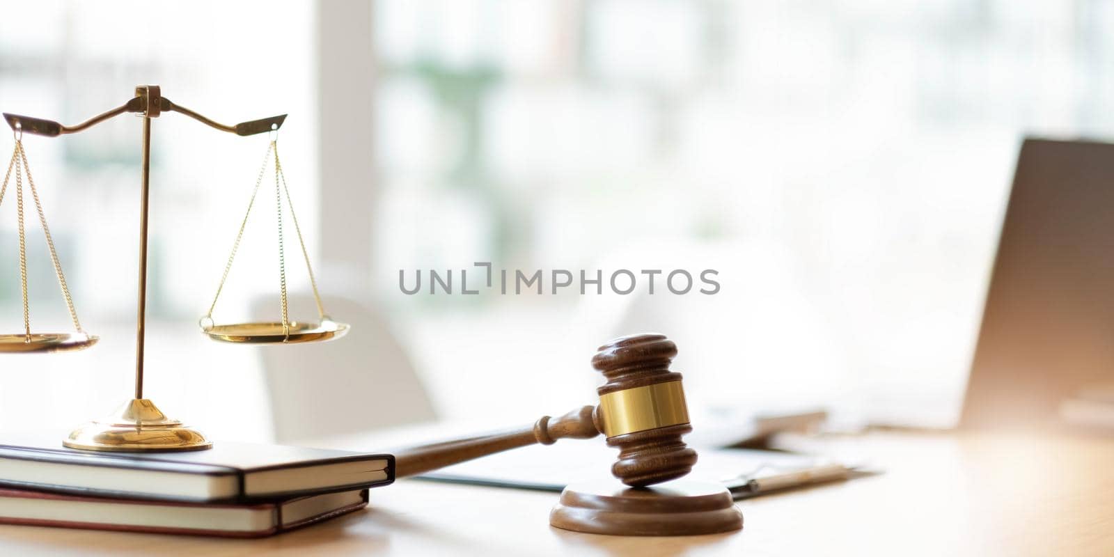 Business and lawyers discussing contract papers with brass scale on desk in office. Law, legal services, advice, justice and law concept picture with film grain effect.