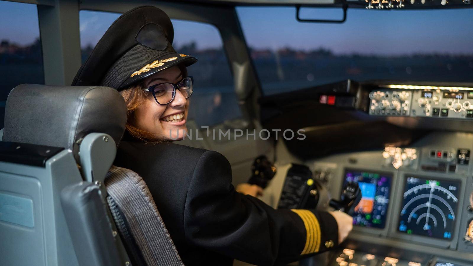 Female pilot on board the aircraft. Caucasian woman in flight simulator