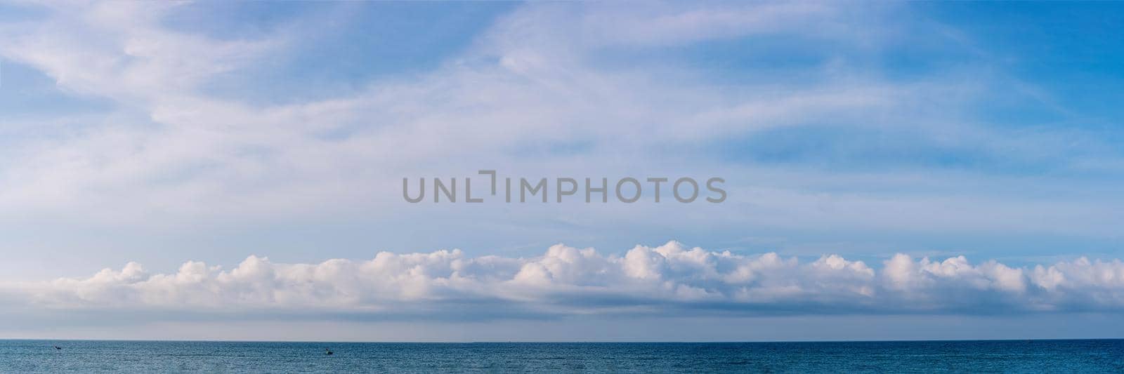 BANNER PANORAMA real photo natural cloudscape wallpaper. Beautiful white fluffy cumulus clouds summer blue sky calm horizon skyline. Concept relax mood, more size and tone collection in stock.
