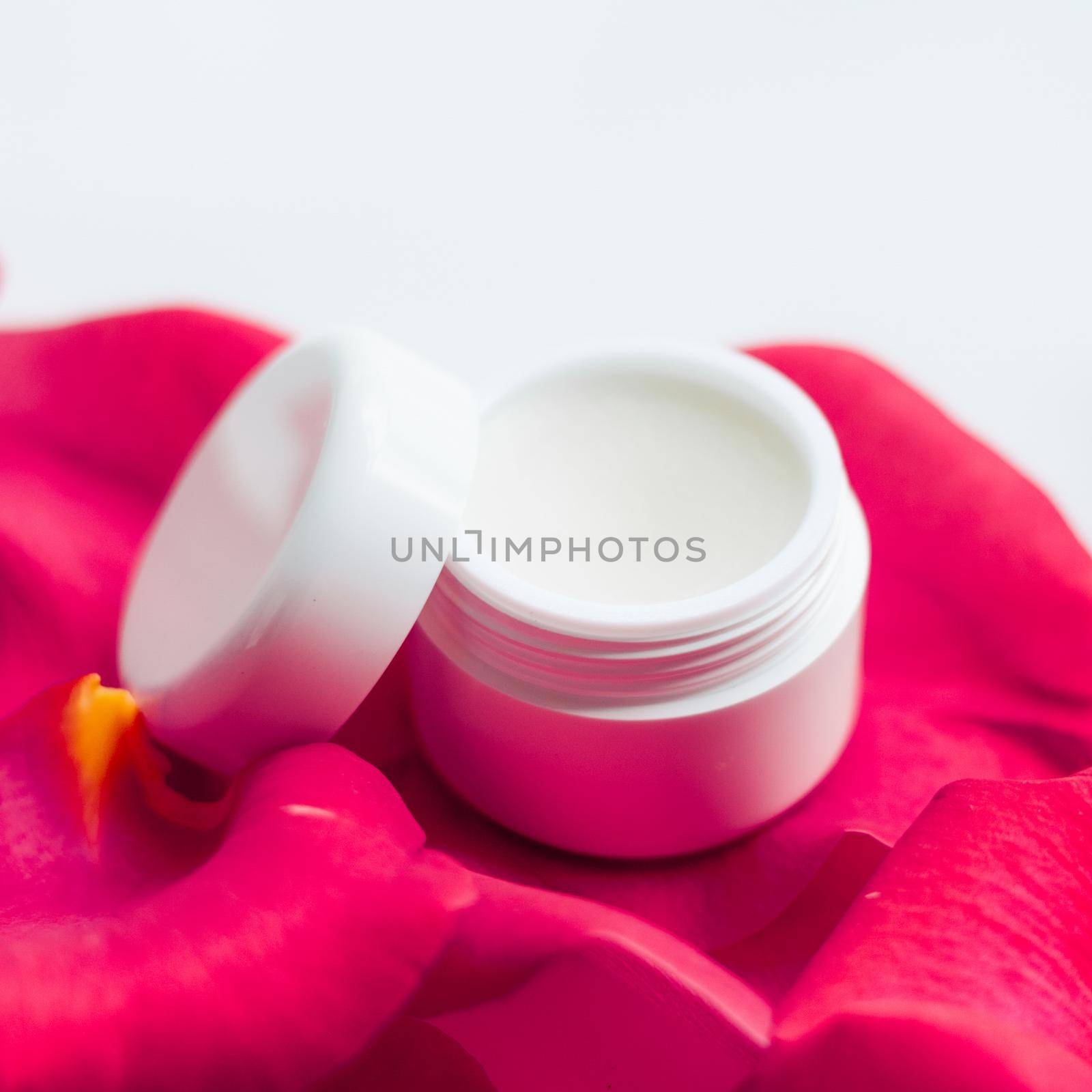 beauty cream jar and rose petals - cosmetics with flowers styled concept by Anneleven