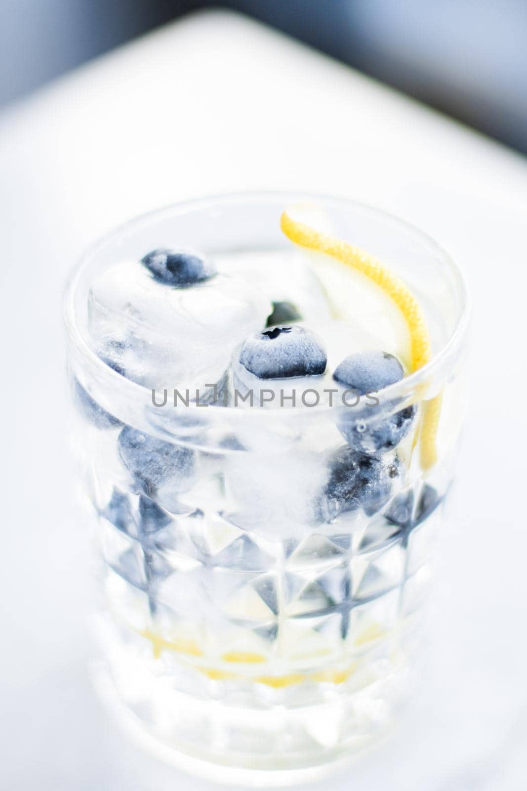 drinks, cocktails and celebration styled concept - cocktail with blueberry ice and lemon, elegant visuals