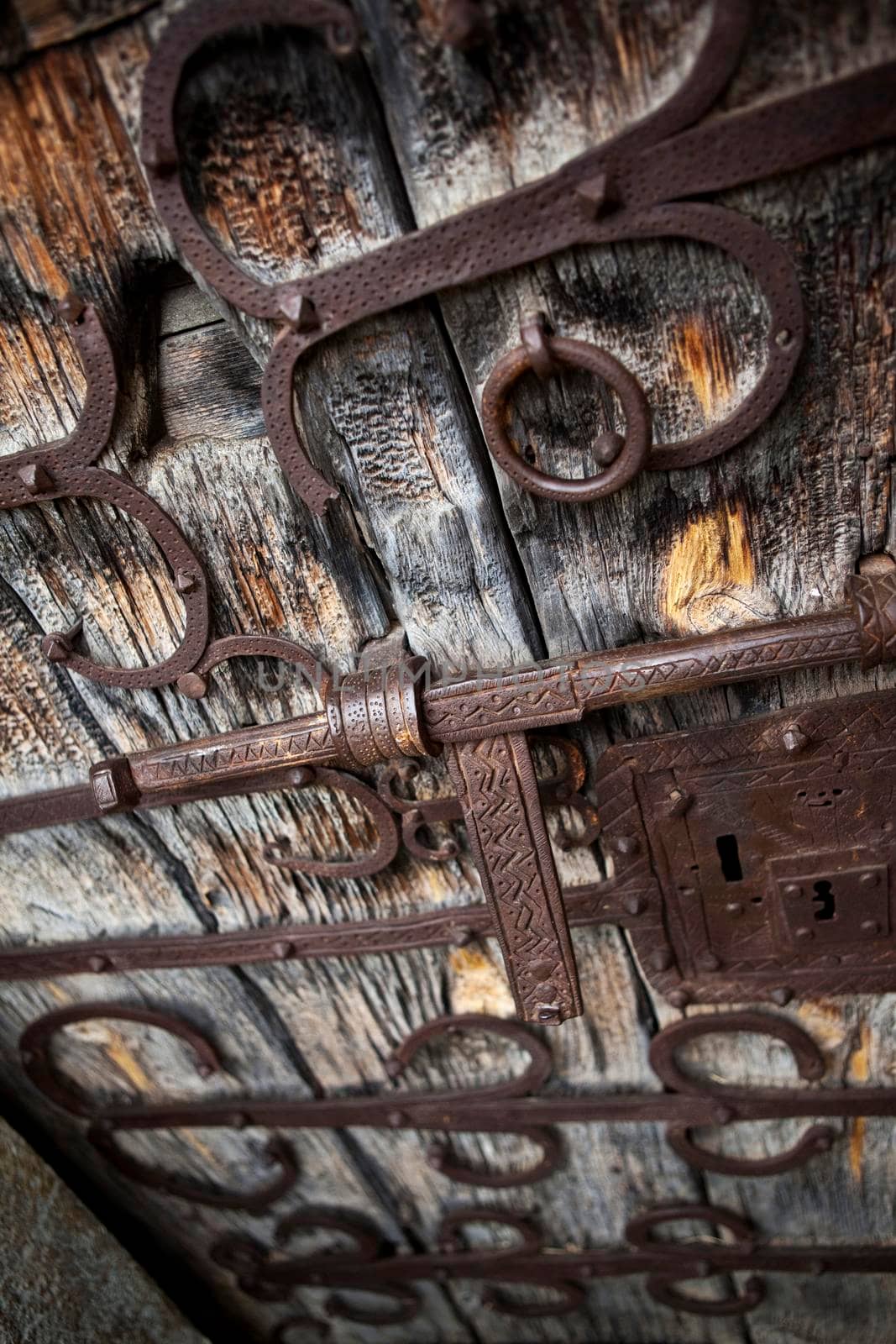 Bronze frame on an old wooden door of a church