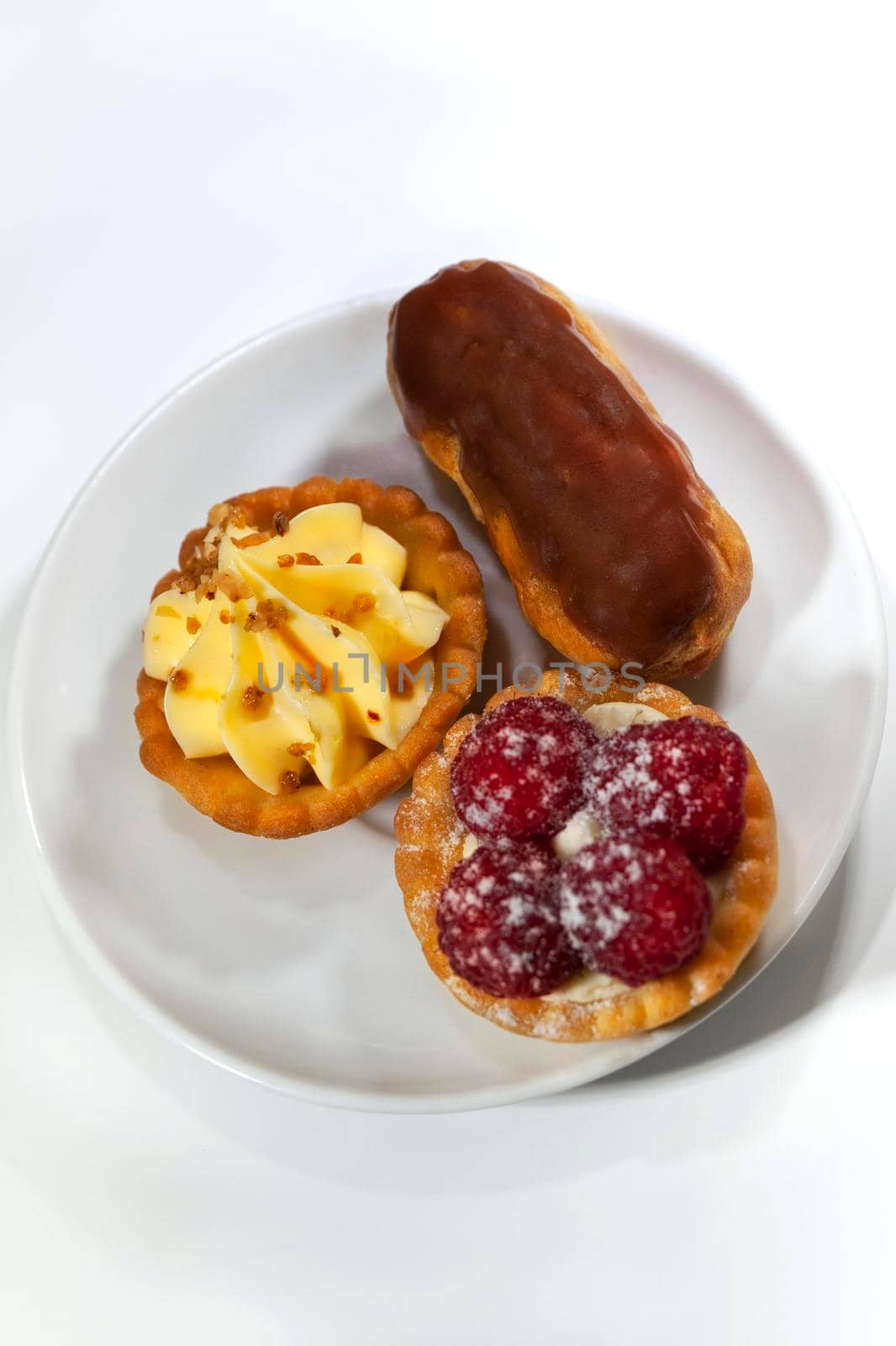 Various French pastries on a plate in a tea room