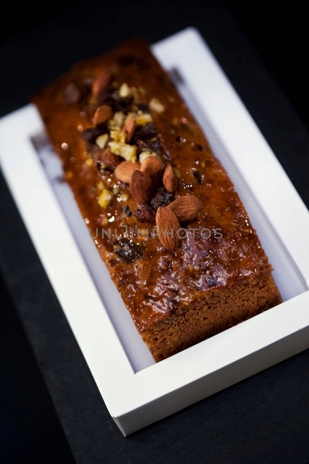 Almond cake and dried fruit on a dish