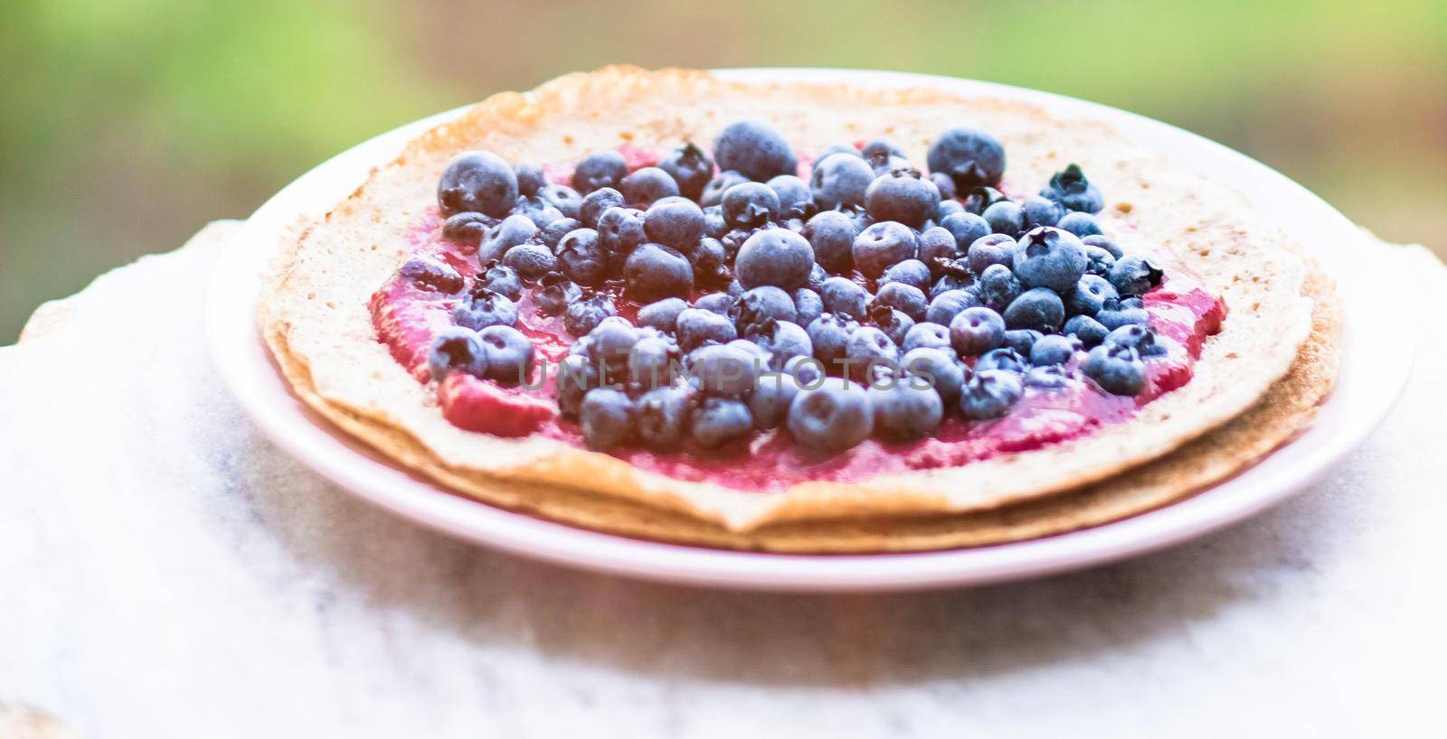 pastry dessert with blueberries - rustic cuisine recipes concept by Anneleven
