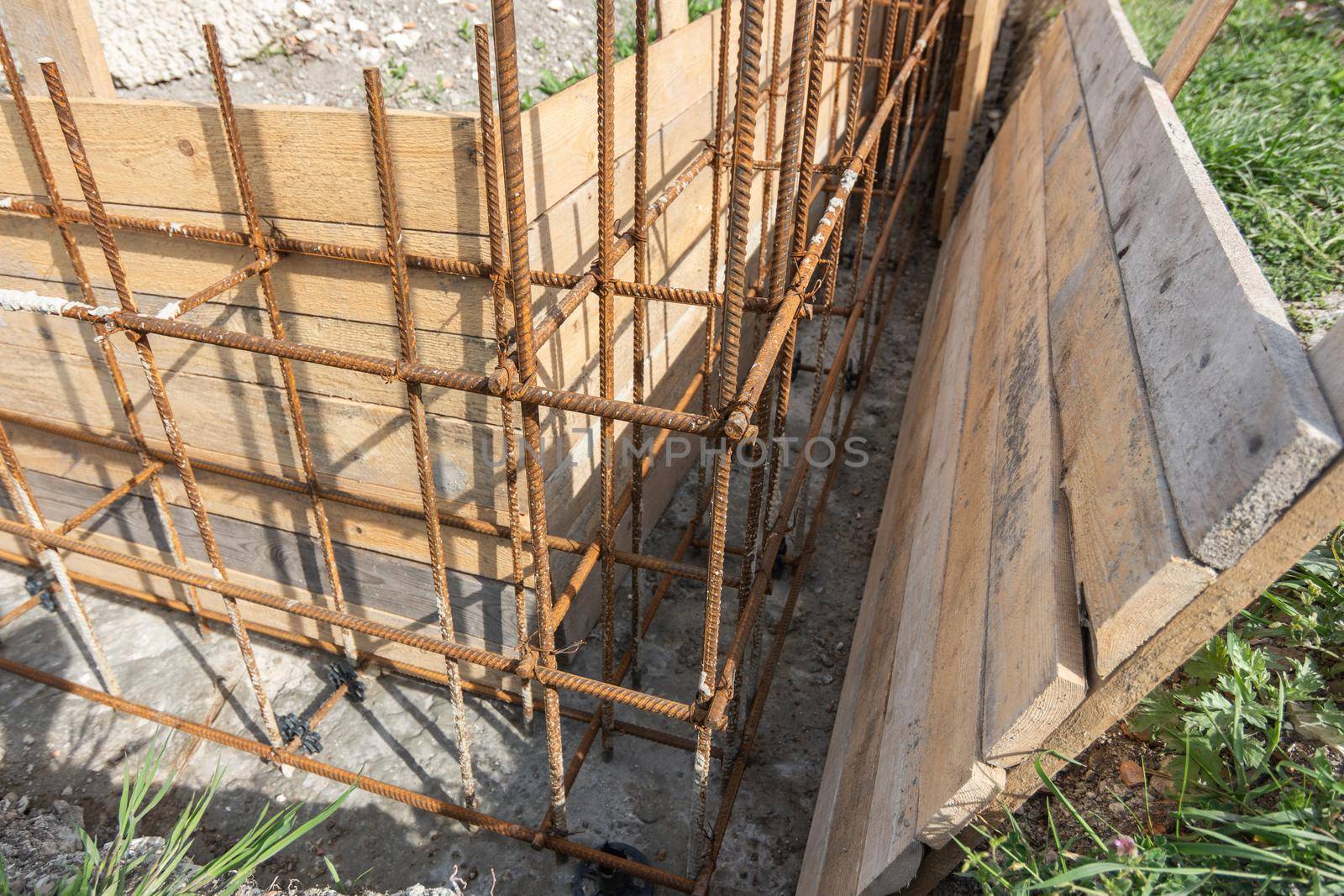 Installation of formwork during the construction of a strip, shallow foundation, close-up