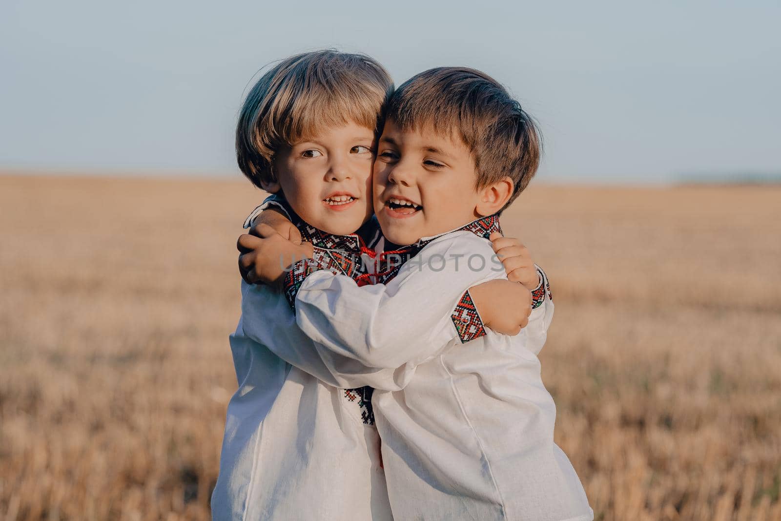 Smiling little ukrainian boys. Children together in traditional embroidery vyshyvanka shirts. Ukraine, brothers, freedom, national costume, win in war. High quality photo