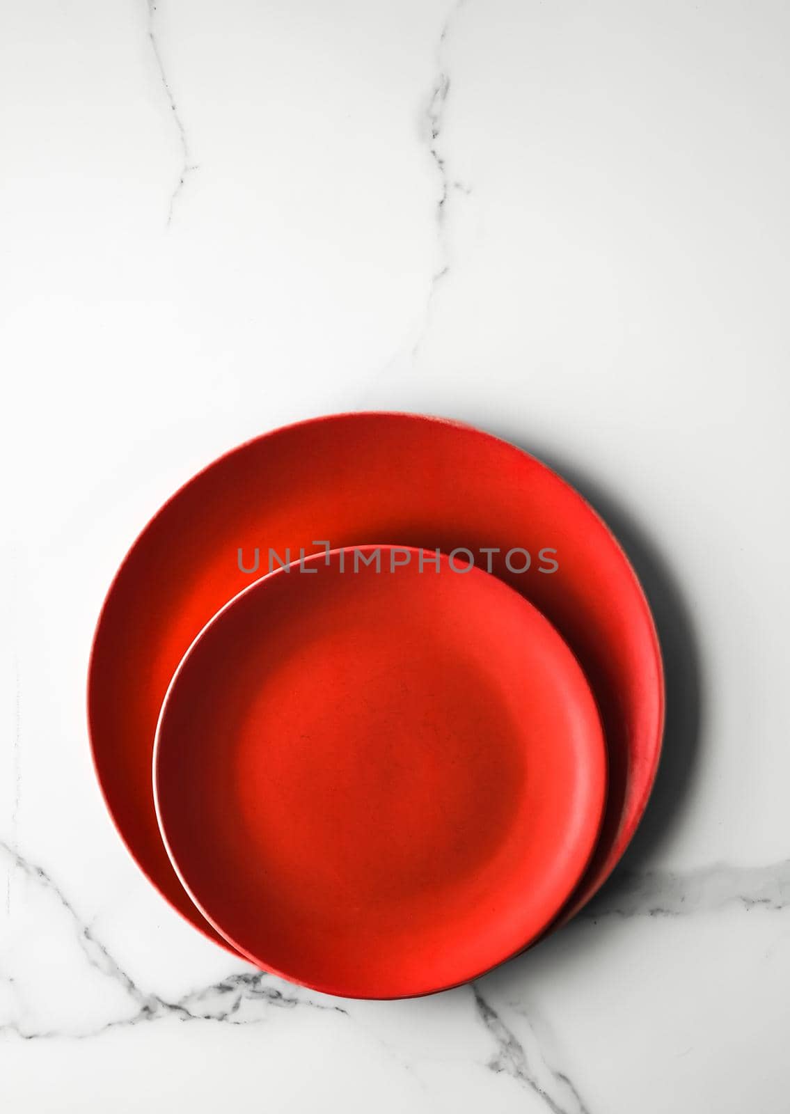 empty red plate on marble - recipe and restaurant mockup flatlay styled concept