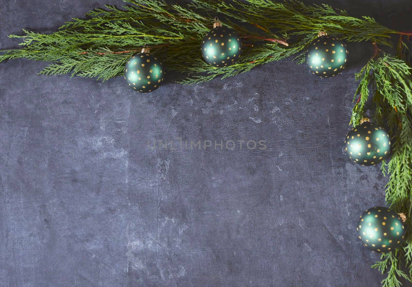 festive Christmas or new year table decor with fir branches, holly branches with red berries and green christmas balls. High quality photo
