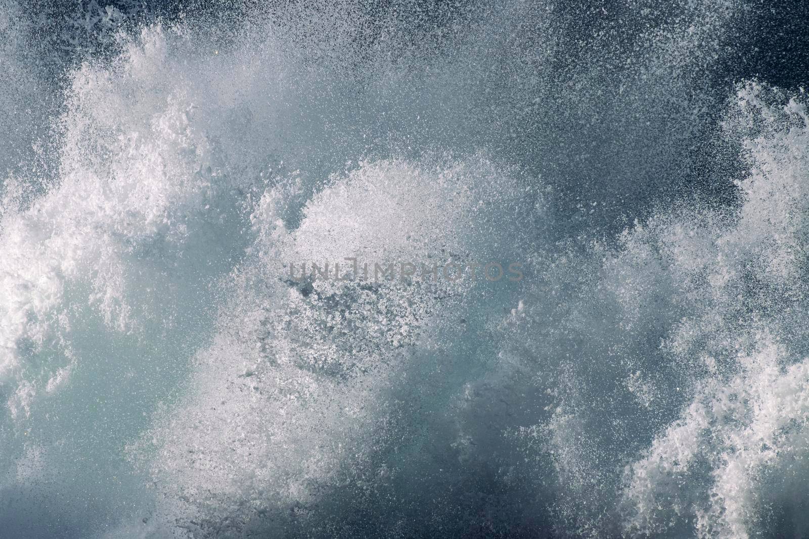 Macro photo of sea foam in motion as it crashes dramatically with water droplets in the air. Bondi Beach, Sydney, New South Wales, Australia taken with Canon EOS 90D