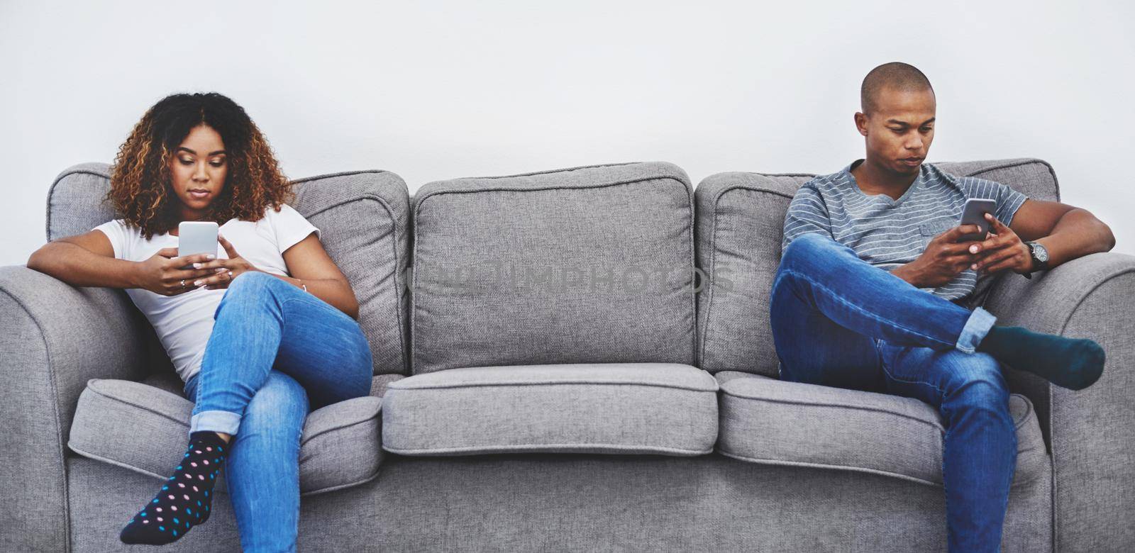 Arguments are never nice. a young couple sitting on the sofa after an argument