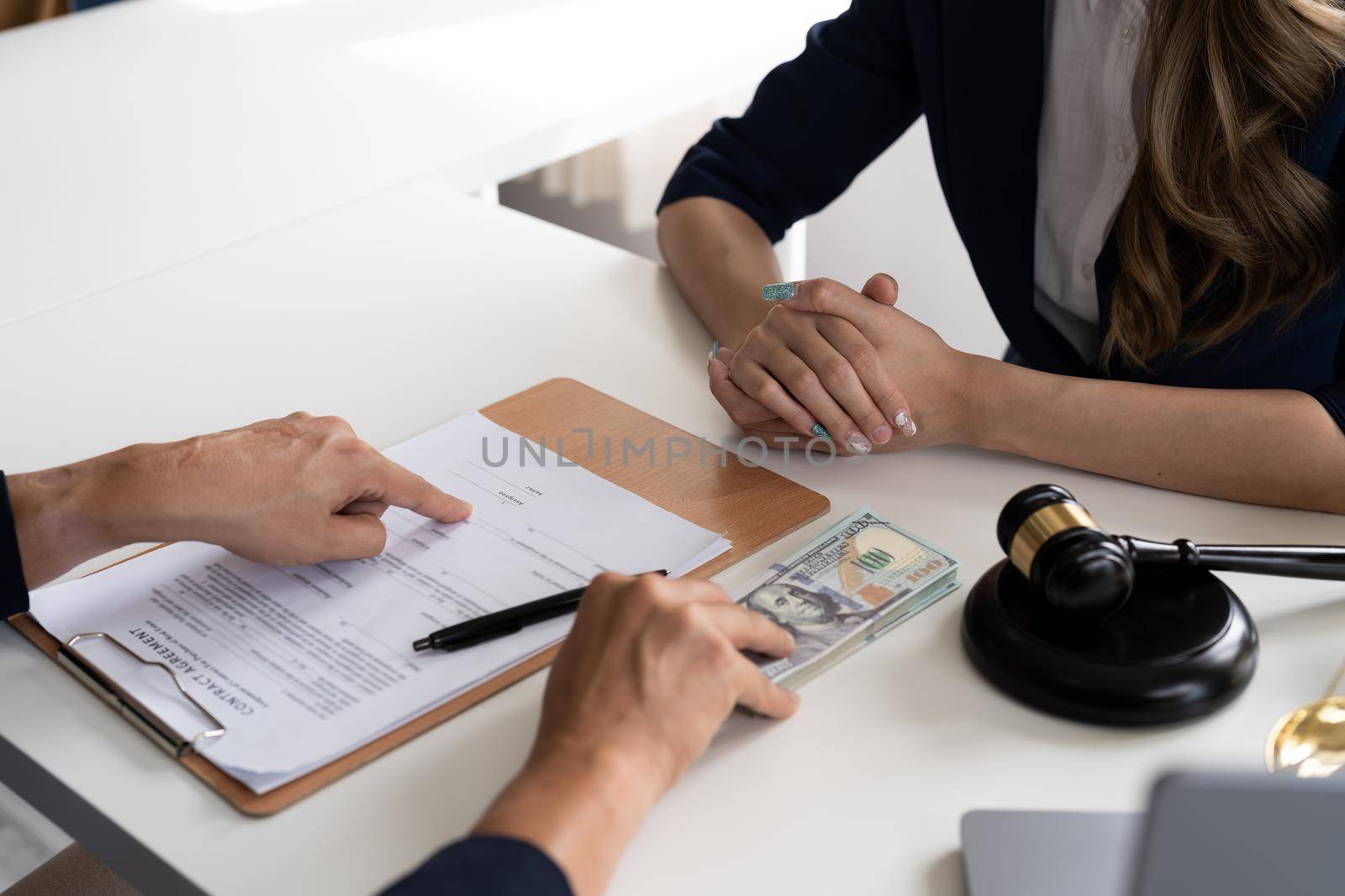 Business people negotiating a contract. Human hands working with documents at desk and signing contract