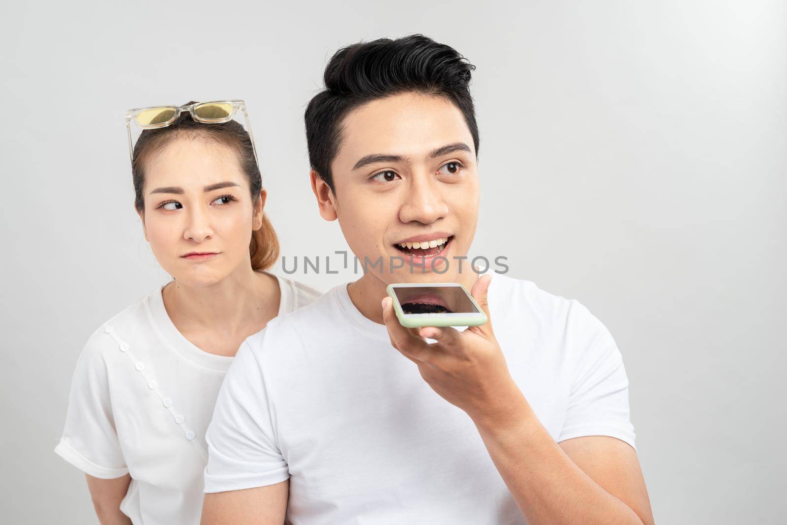 Woman spying her boyfriend mobile phone