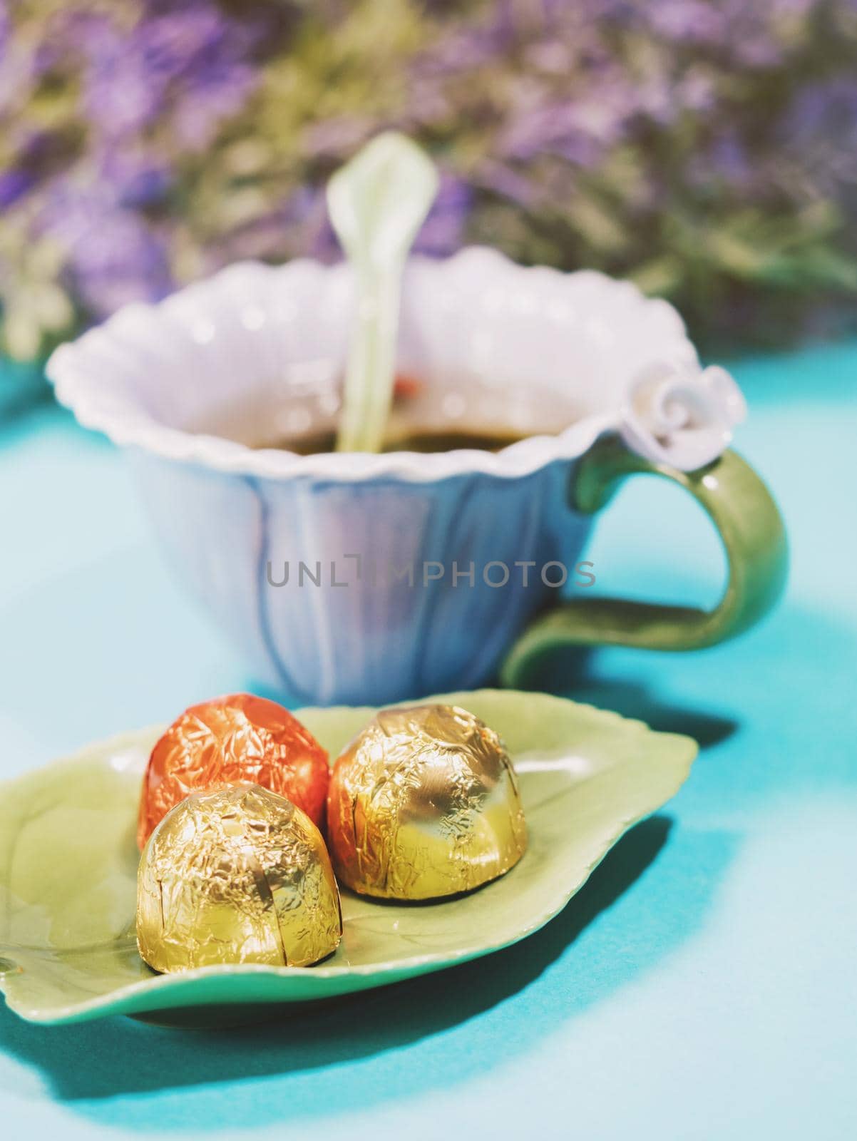 Handmade beautiful flower cup of fragrant tea violet porcelain and candies