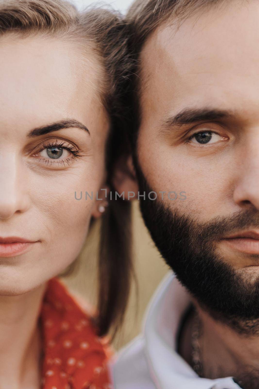 Cropped portrait of middle-aged couple, a man and woman leaning their faces against each other
