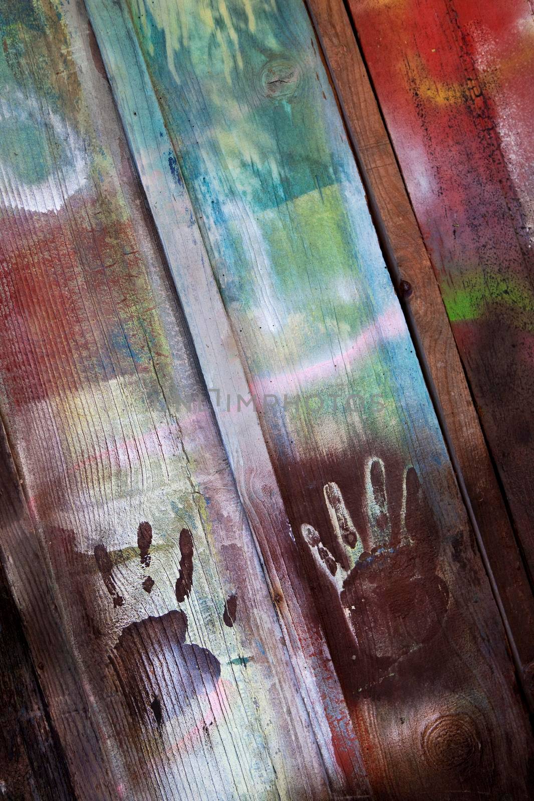 Handprints on a painted wooden wall