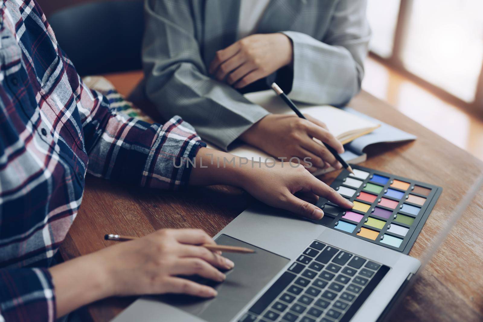 A group of professional web developer and graphic designer working together in the office.