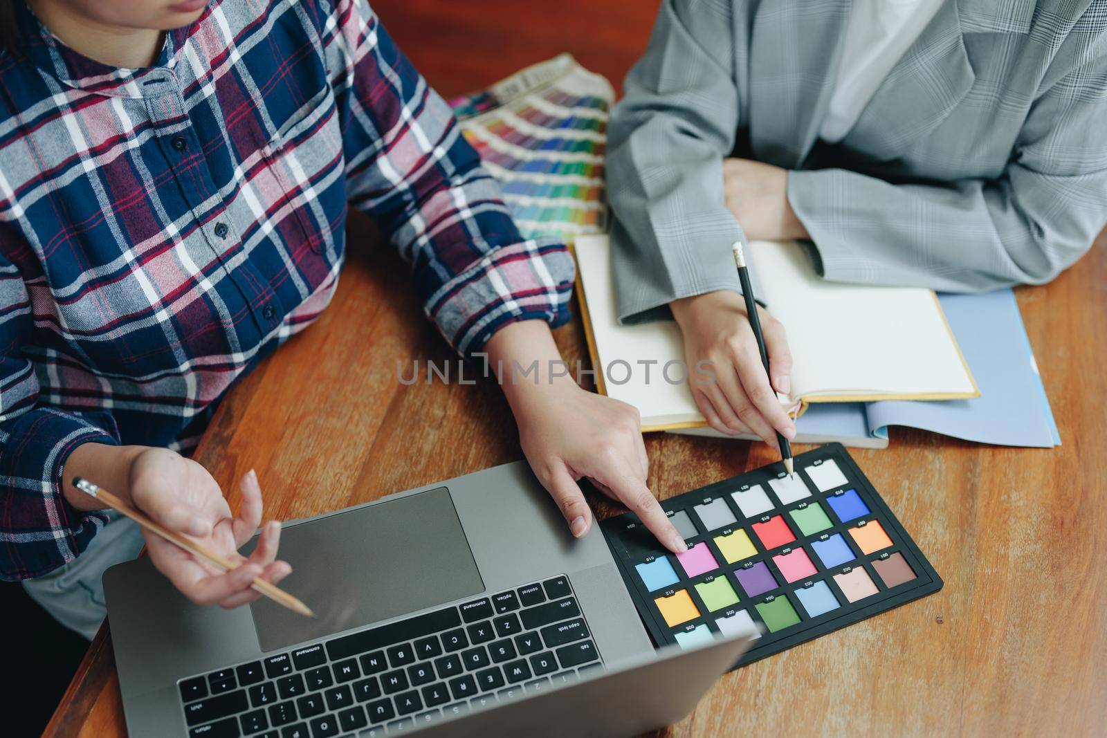 A group of professional web developer and graphic designer working together in the office.