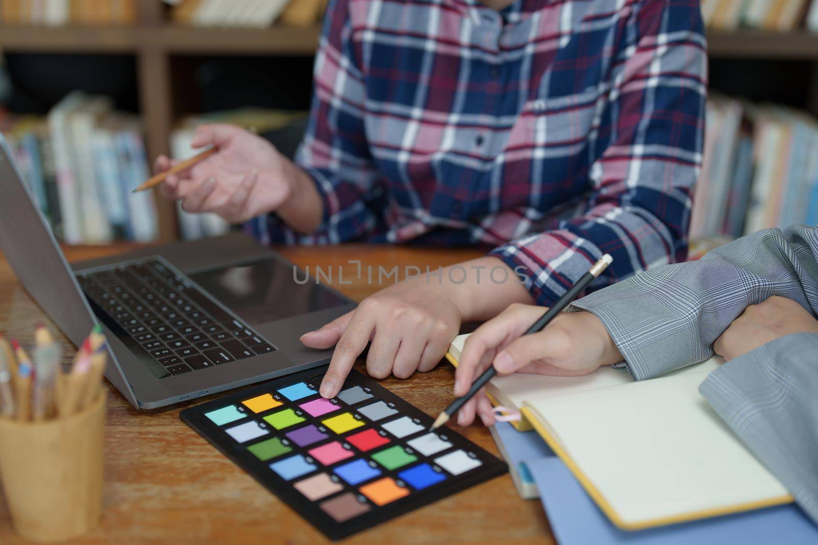 A group of professional web developer and graphic designer working together in the office.