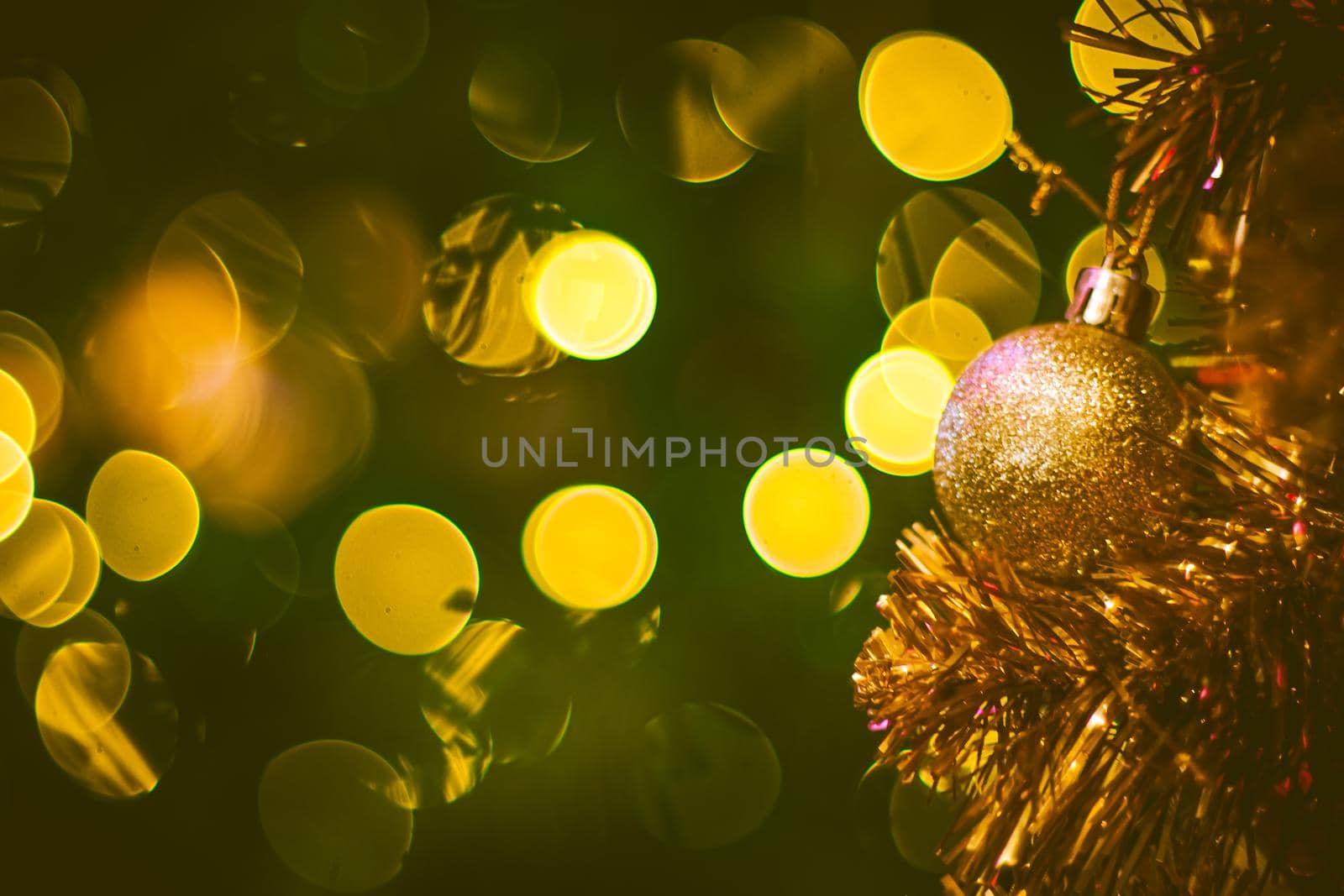 Christmas ball decoration on yellow background. Colorful blur bokeh background. christmas background by Petrichor